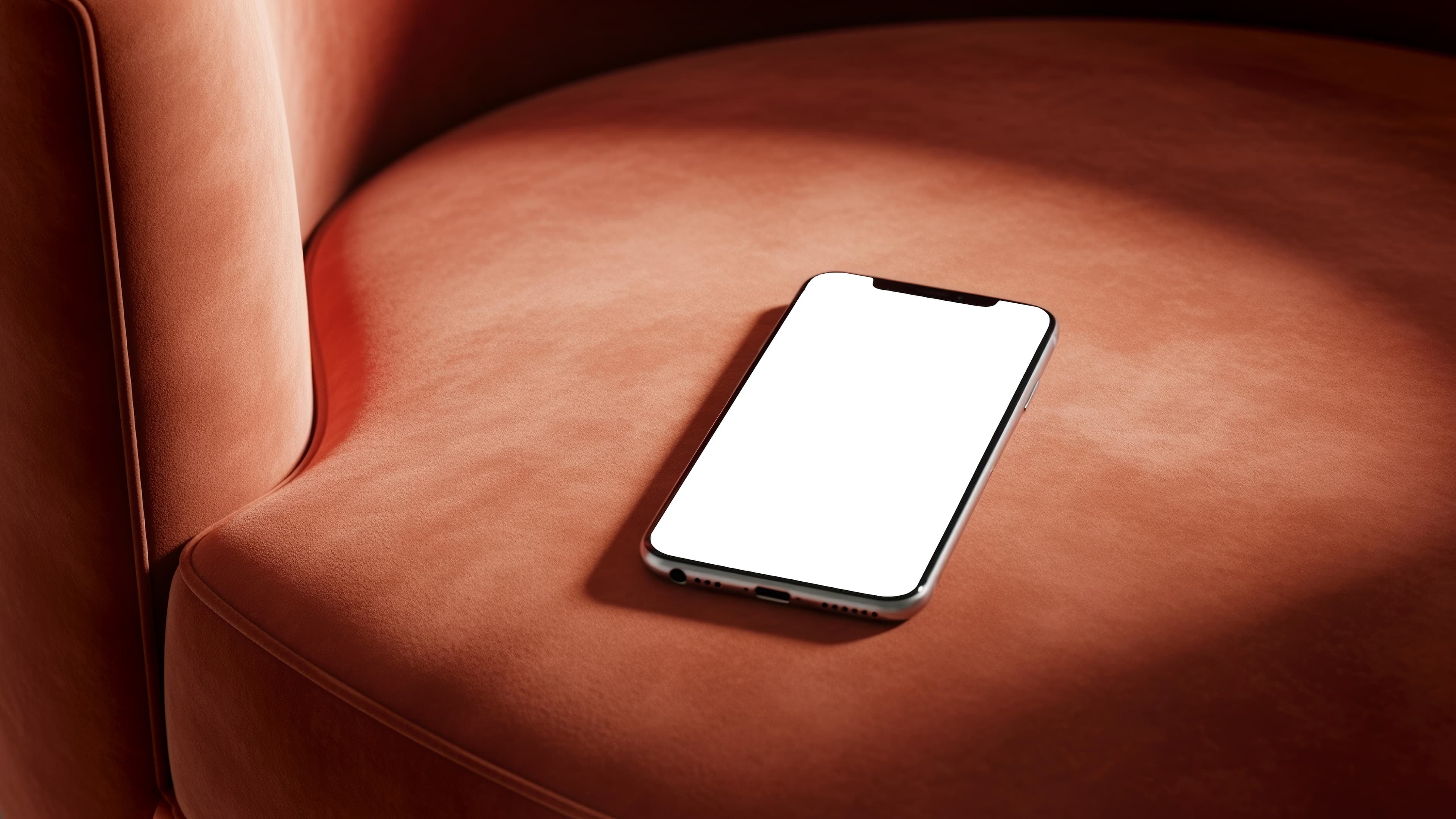 Telefone celular sobre poltrona