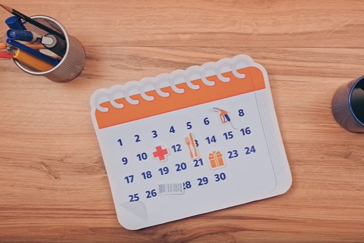 Imagem de uma ilustração de calendário com as cores laranja e azul do Itaucard.